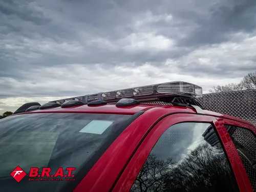 Cab roof close-up with roof rack and warning lights.