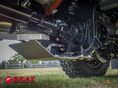 Front axle and suspension close-up from low angle.