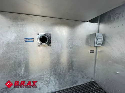 Compartment interior wall with port fitting and outlet box.