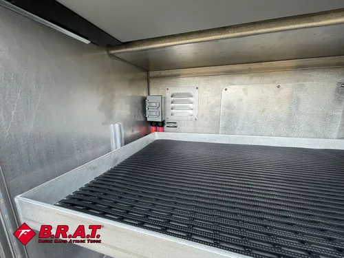 Wide compartment interior with ribbed floor and rear outlet panel.