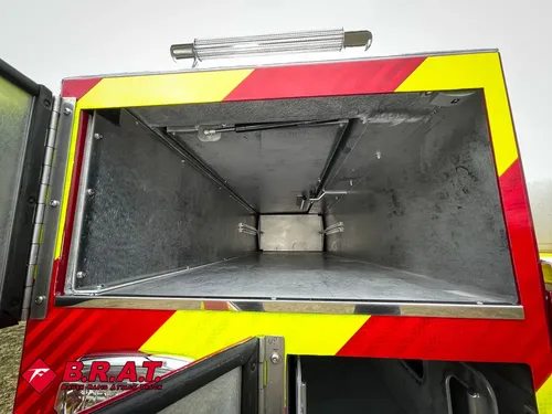 Open tapered rear compartment with smooth metal interior.