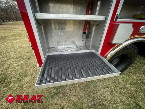 Pull-down tray extended from a lower side compartment.