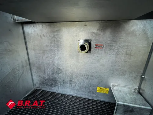 Interior compartment wall with a small circular fitting port.