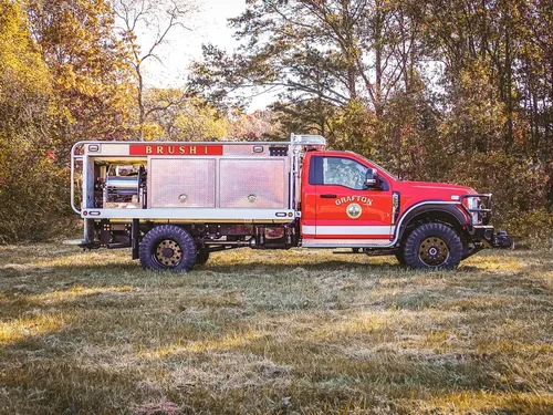 Left-side profile of truck with side body panel and cab visible.