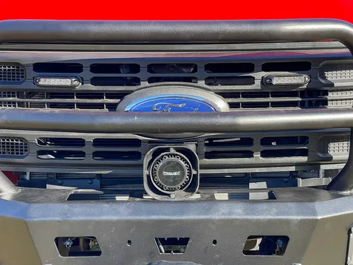 Front grille close-up with Ford emblem and center speaker/light.