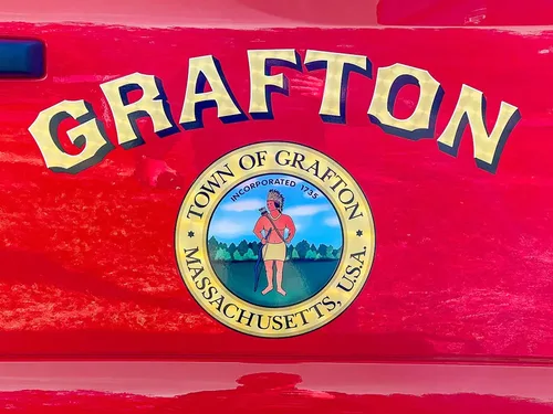 Door emblem close-up reading Grafton with town seal beneath lettering.