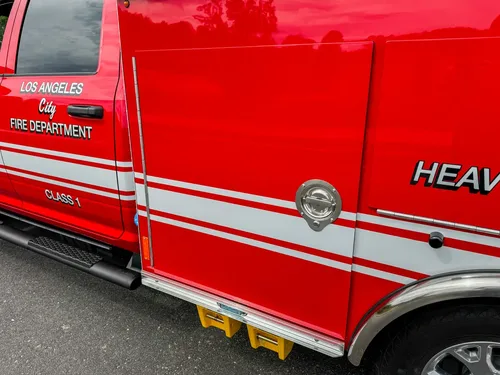 Side body panel close-up with heavy equipment lettering.