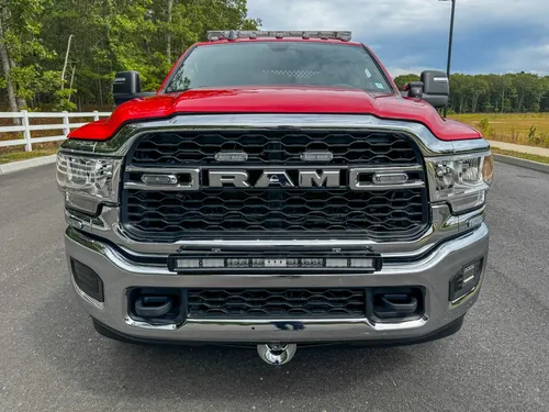 Head-on front view of truck with RAM grille.
