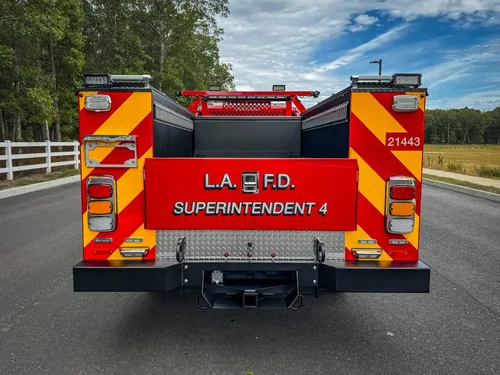 Straight rear view of truck with red-yellow chevron pattern.