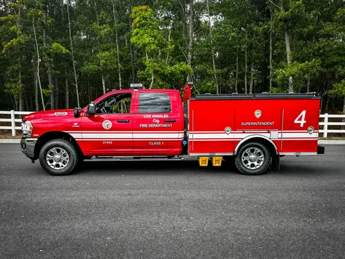 Driver-side profile with utility body and compartment doors.