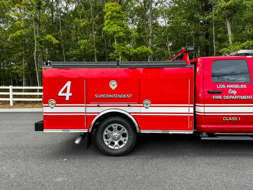 Mid-body side view with unit number and side striping.