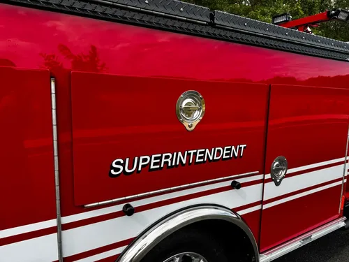 Side body panel close-up with superintendent marking.