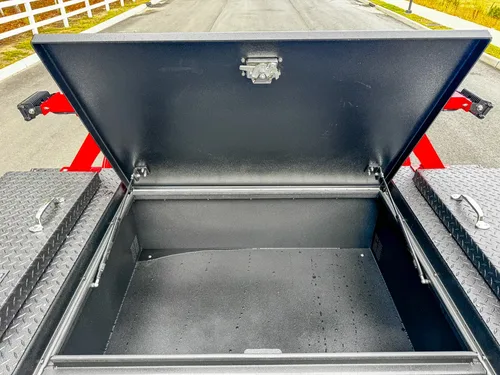 Interior of front bed storage box with open lid.