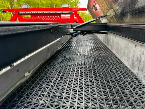 Long bed channel view with anti-slip grated floor.