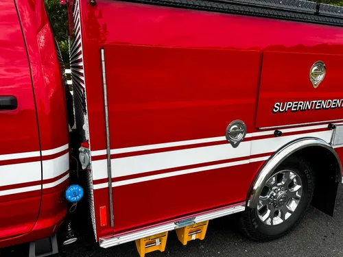 Side panel detail with superintendent text and stripe.