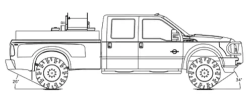 Exterior view of small fire truck showing cab, body compartments, and wheel/tire area.
