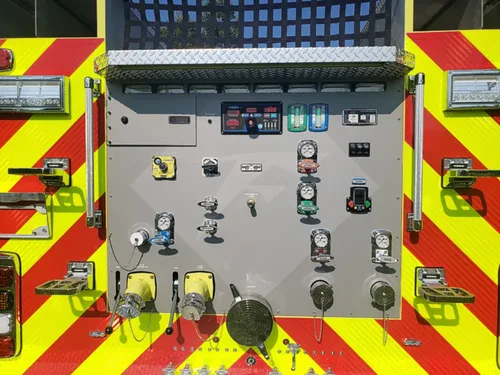 Exterior view of small fire truck showing cab, body compartments, and wheel/tire area.