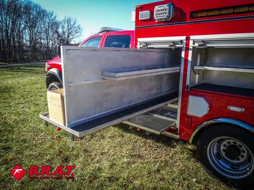 Open side bay with long fold-out shelf panel extended outward.