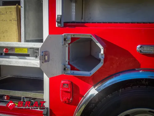 Lower side octagonal intake-port hatch open near wheel arch.