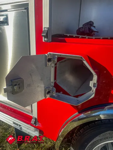 Octagonal side hatch open showing deep intake-port channel.