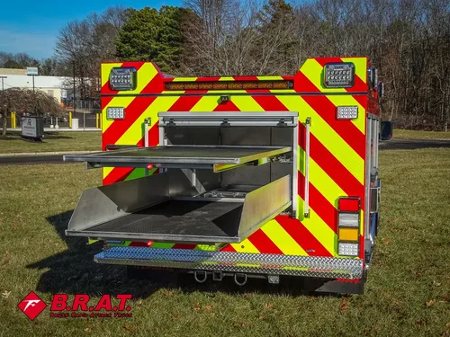 Rear fold-down tray extended from center rear compartment.