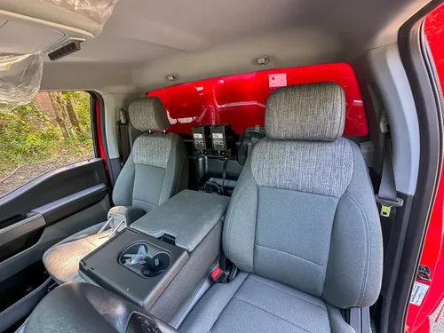 Front passenger-side interior view with seat and center console visible.