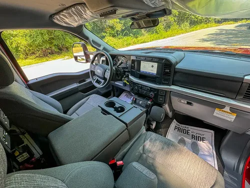 Wide front interior view with dashboard and center work console.