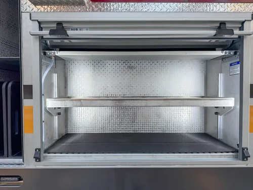 Open side bay with adjustable shelf rails and storage shelves.