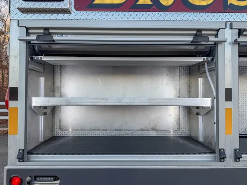 Open side compartment with shelves and empty storage space.