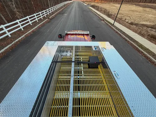 Top deck view looking forward over yellow grated walkway.