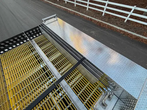 Upper side channel with yellow grating and aluminum walls.