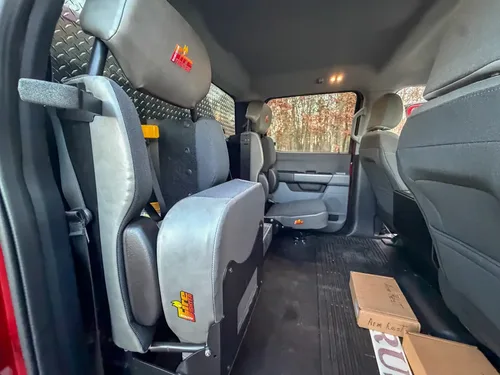 Rear cabin interior from side showing bench seating.