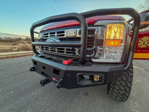 Front grille guard and right bumper corner close-up.