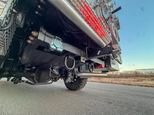 Low rear underbody view with suspension and frame components.