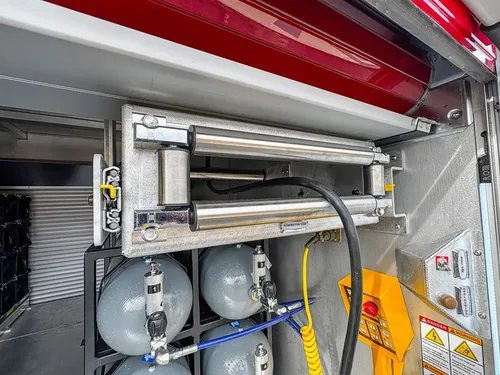 Detail of upper slide assembly over air cylinder bank.