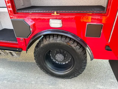 Rear wheel area with utility access covers closed.