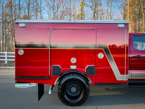 Left-side body close-up with compartment doors closed.