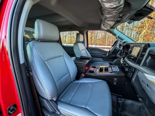 Interior close view of both front seats and center console controls.