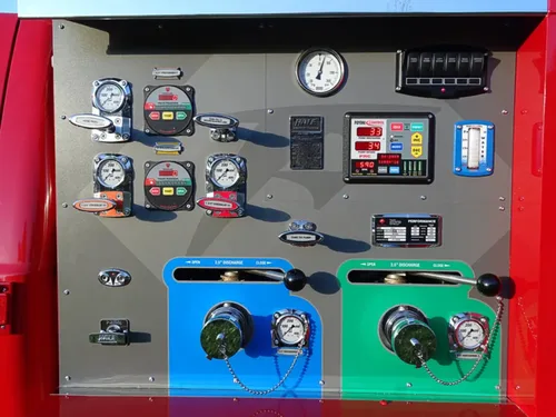 Exterior view of small fire truck showing cab, body compartments, and wheel/tire area.