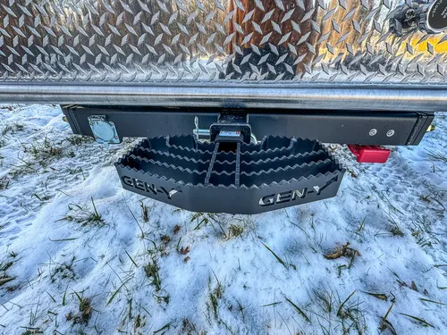 Rear underside view showing hitch receiver and mounted spare tire.