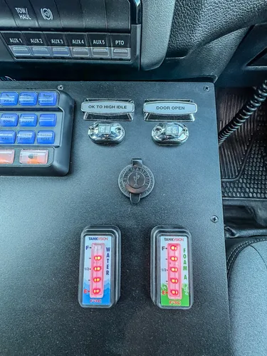 Close-up of dashboard switch panel and ignition area.