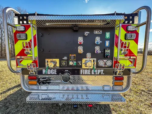 Straight rear view of the pump panel framed by chevron-striped rear corners.