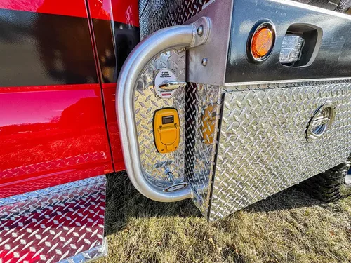 Open small body compartment door with latch hardware and marker light.
