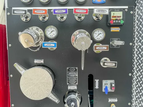 Pump panel close-up showing capped inlets, gauges, and labels.