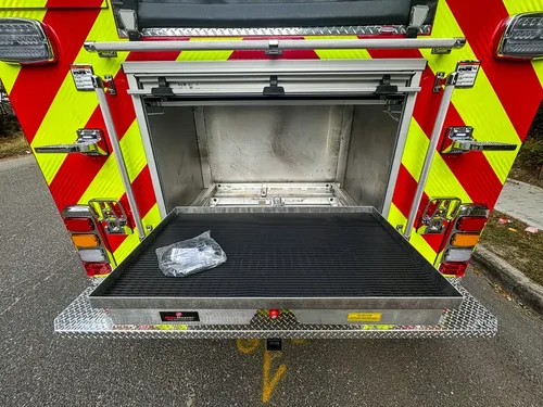 Rear compartment open wide with deep interior and lower tray.