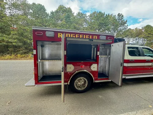 Right-side open bay with deep shelf storage and door swung outward.