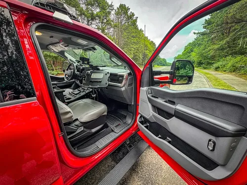 Open front passenger door view into the front cabin.