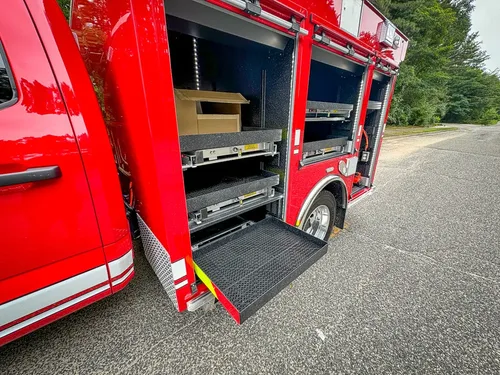 Angled side view of open compartments and nested slide-out trays.