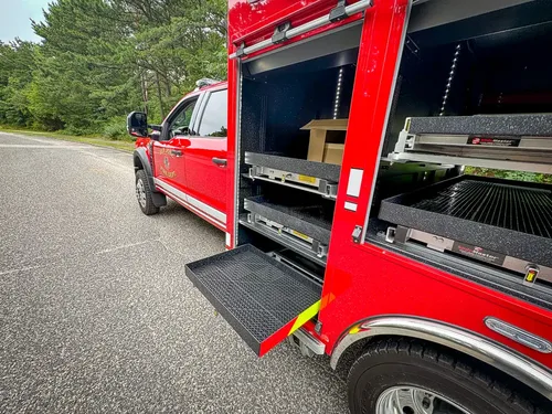 Long right-side compartment open with shelves and lower tray partially extended.