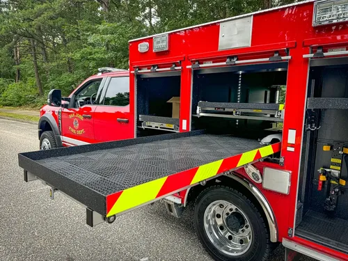 Side compartment view with full-width slide-out deck extended.